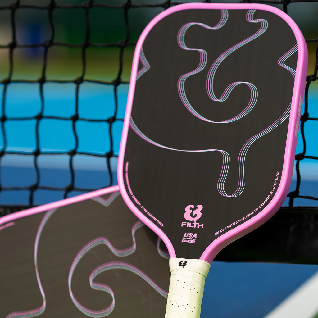 A pink  Bread & Butter SHOGUN 16mm 2024 Elongated Pickleball Paddle, available at iampickleball.store.