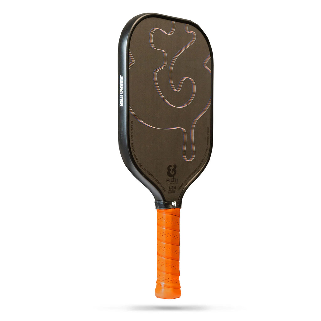 A black and tan Bread & Butter FILTH 16mm 2024 Elongated Pickleball Paddle, available at iamracketsports.com.