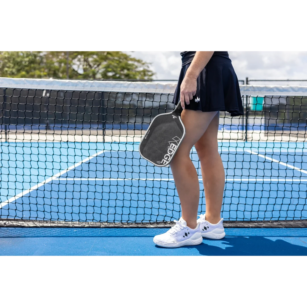 A player holding a Diadem EDGE 18K SPEED PRO Pickleball Paddle, available at  iam-Pickleball.com, Miami store.