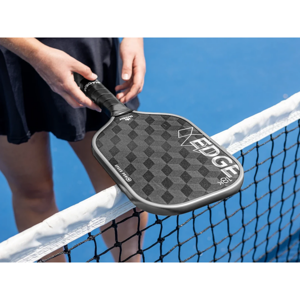 A player holding a Diadem EDGE 18K SPEED PRO Pickleball Paddle, available at iamRacketSports.com.