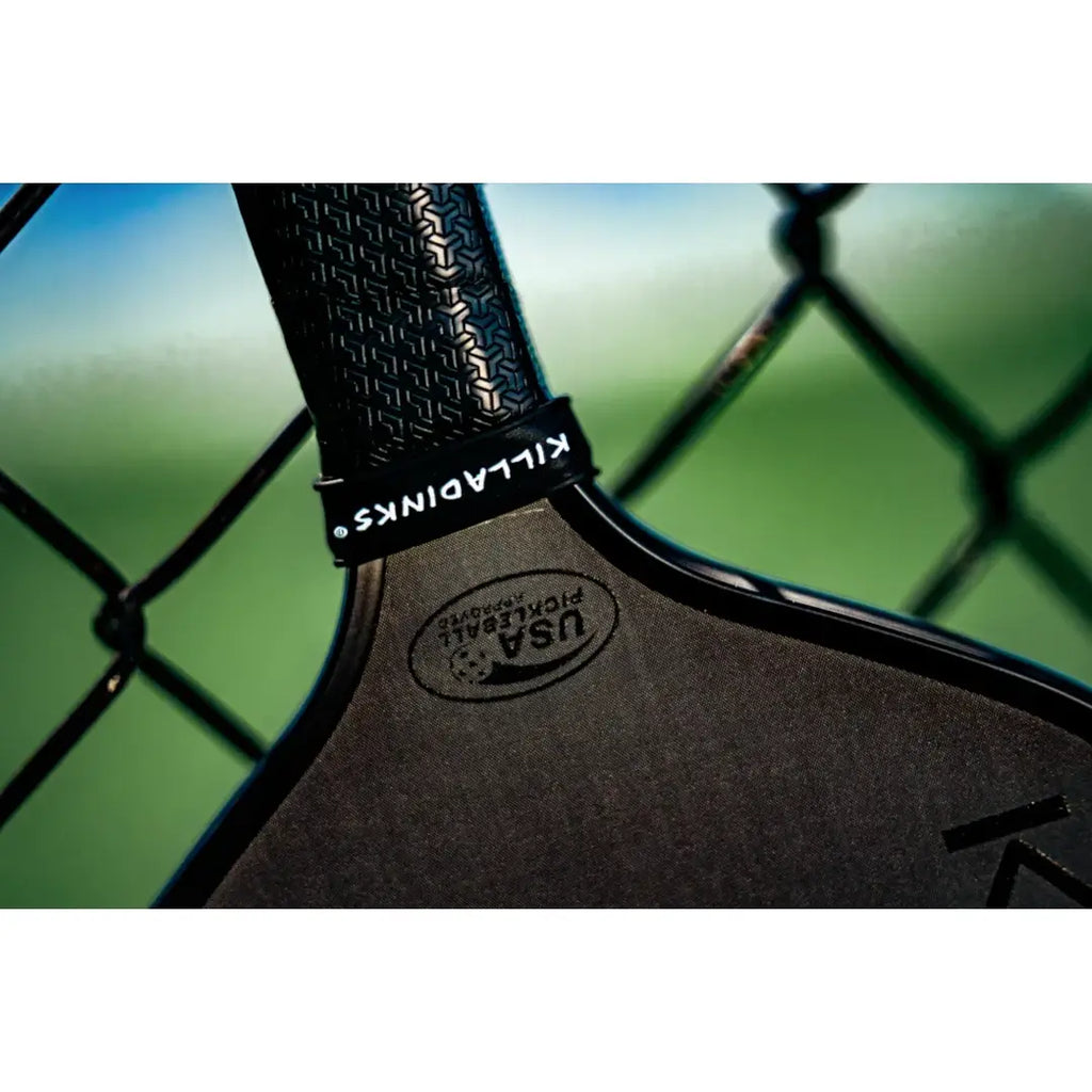 The handle of a Carbon Fibre, 16 mm, Honeycomb core, Killa Dinks RUSH-01 PickleBall Paddle. Available from iam-Pickleball.com.