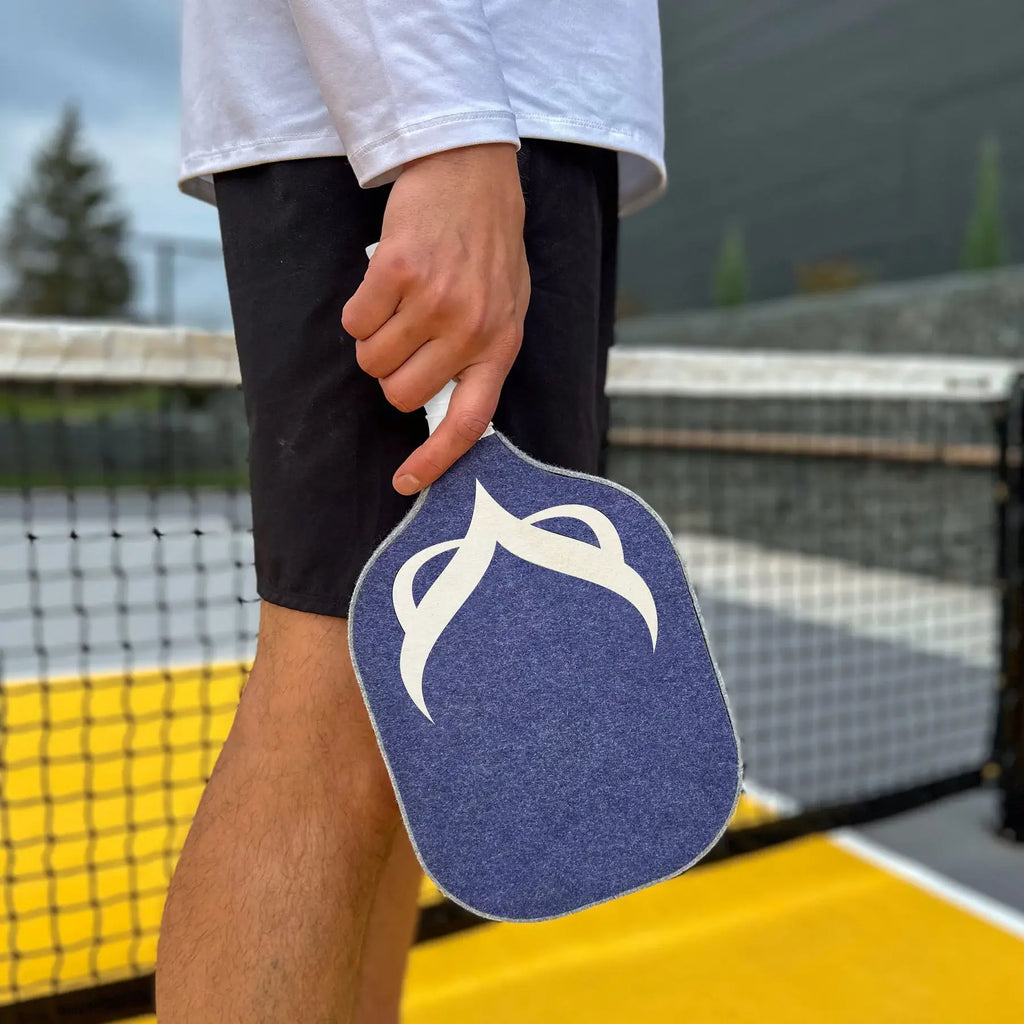 Player holding the OWL PXE Pickleball 13mm Elongated Paddle, purchase from iamPickleball.store.