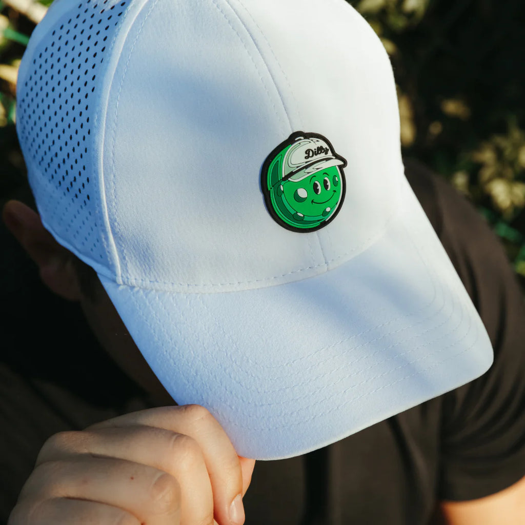 A white Pickle Brand DILLY 6 Panel Performance Hat, available from iamRacketSports.com.