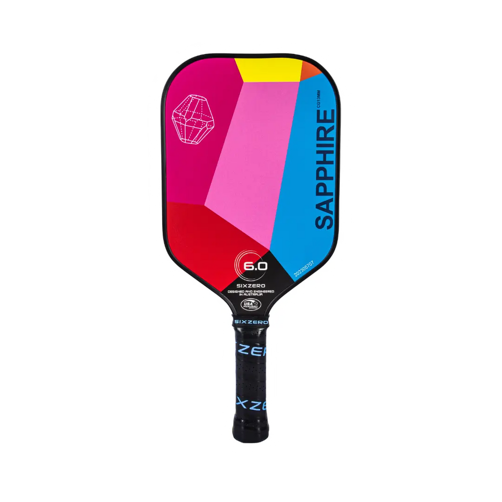 SPORT: PICKLEBALL.  Shop Siz Zero at iamRacketSports.com. A vertically standing  Six Zero GEM SERIES SAPPHIRE PickleBall Paddle, with a multi-colored face.