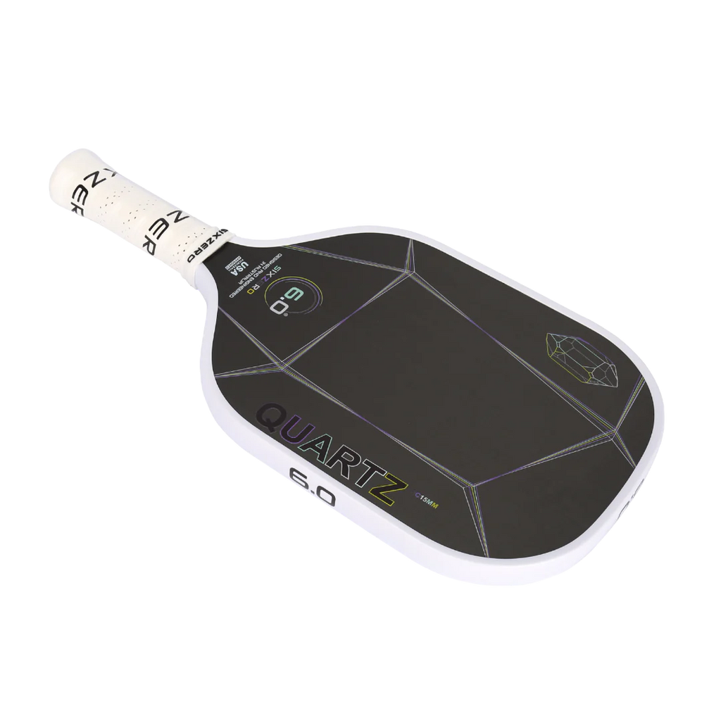 A white Six Zero QUARTZ 15mm PickleBall Paddle, purchase at "iam-pickleball.com".
