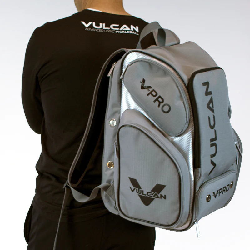 SPORT: PICKLEBALL. Shop Vulcan Sporting Goods at "iamracketsports.com". A person carrying a Vulcan VPRO Pickleball Backpack.