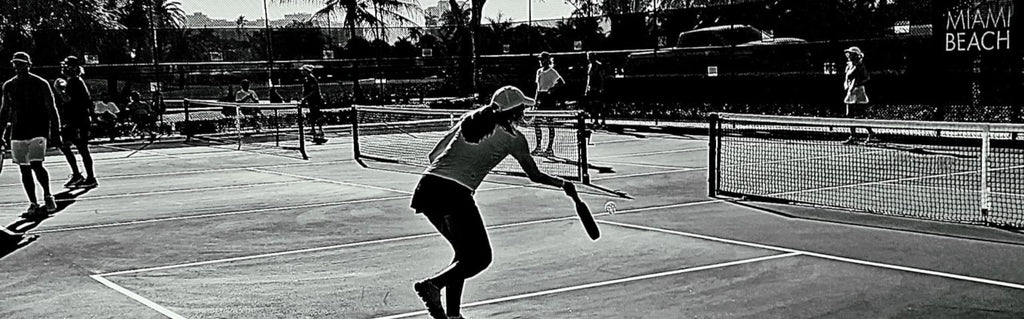 iamRacketSports - Stocks all your Pickleball needs.  Shipping USA, Canada, Mexico and World Wide*.   Female player on miami beach pickleball courts.