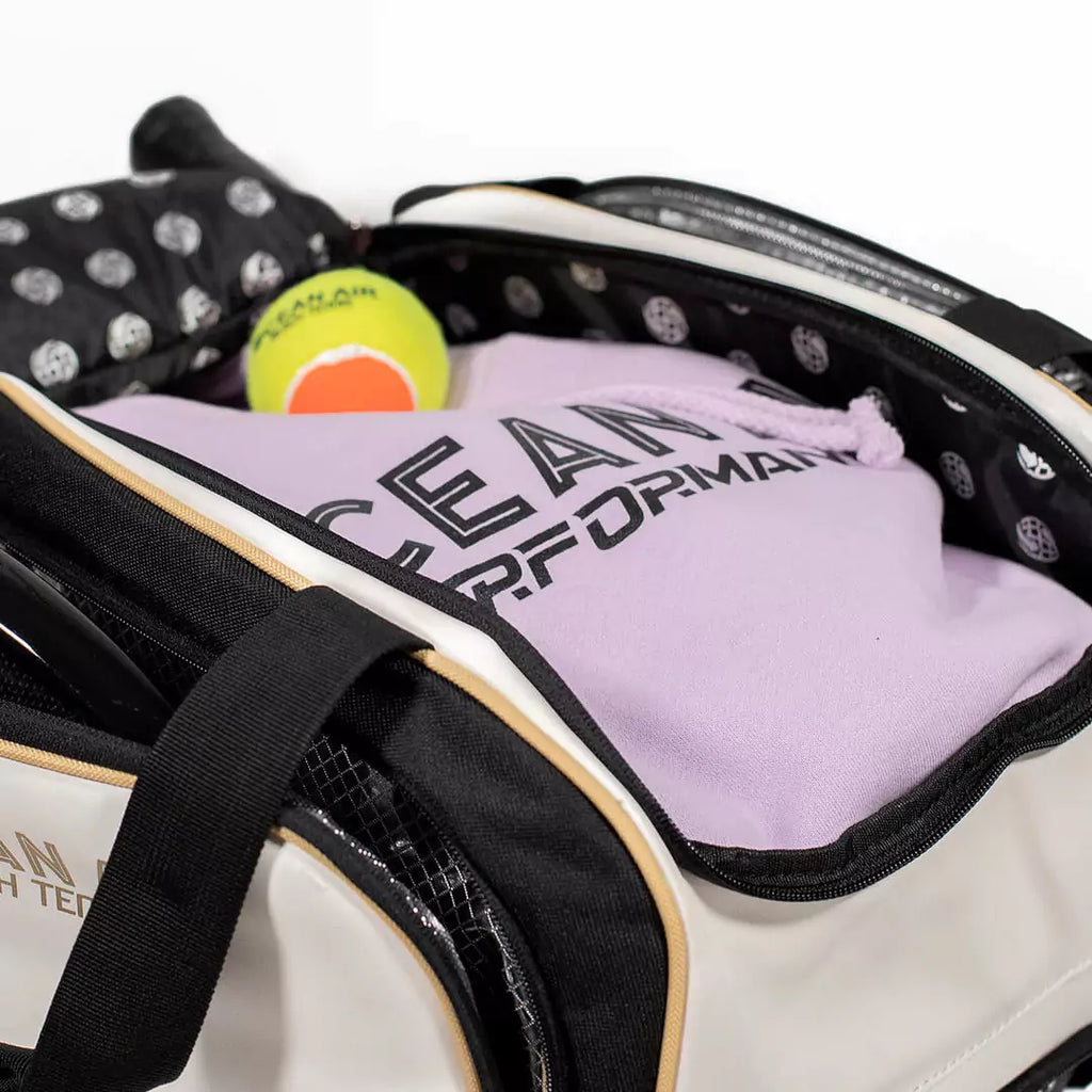 Shop Padel Bags at iamBeachTennis, Miami, Florida  - Bag model is an Ocean Air Performanace PRO BT COMPACT bag in White. Bag with open compartment.