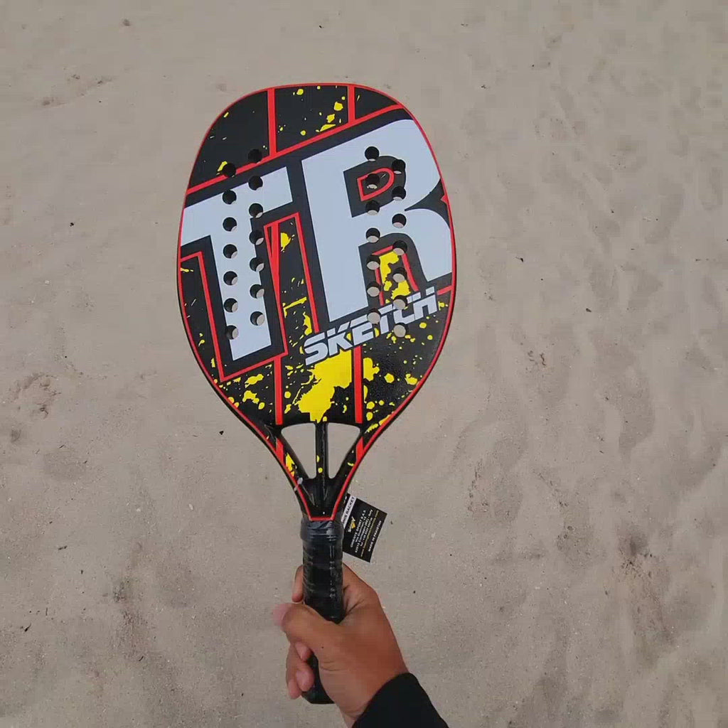 Top Ring Beach Tennis Brand, Model Sketch red/yellow, Beginner/Intermediate Beach Tennis racket / paddle. Video shows racket front and back and been spun.