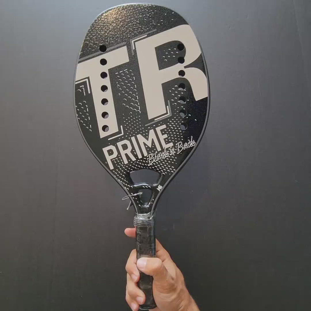 Top Ring Beach Tennis Brand, Model TR Prime black/white, Advanced/Professional Beach Tennis racket  paddle. Video shows racket front and back and been spun.
