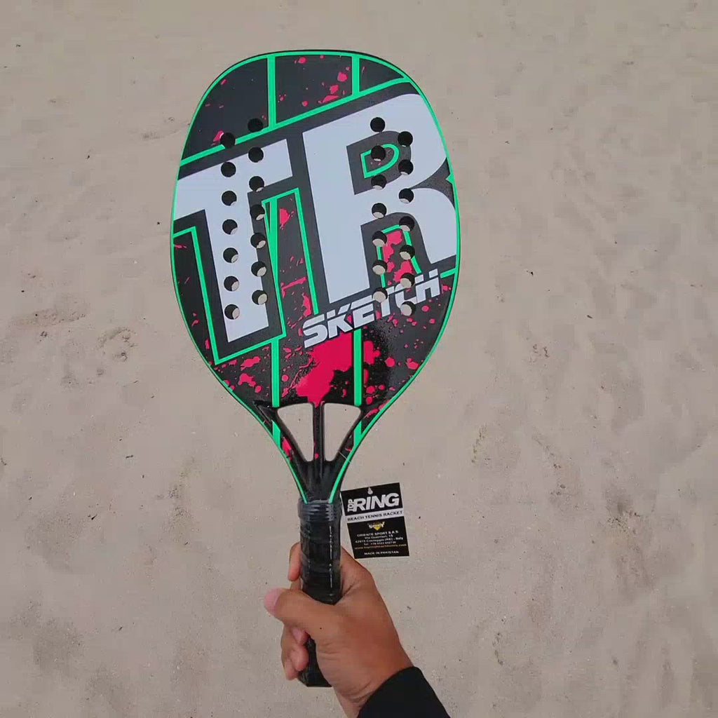Top Ring Beach Tennis Brand, Model Sketch green/magenta, Beginner/Intermediate Beach Tennis racket/paddle. Video shows racket front and back and been spun.