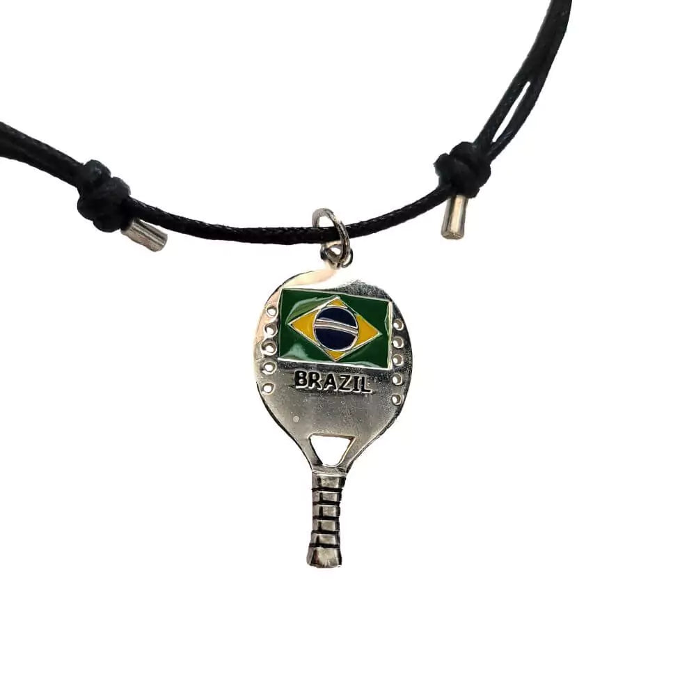 Shop Necklaces - Kreoli Bijoux Black Necklace with Beach Tennis Racket showing Brazilian flag. Simple braided cord featuring a Beach Tennis Raquet with flag. Close up.