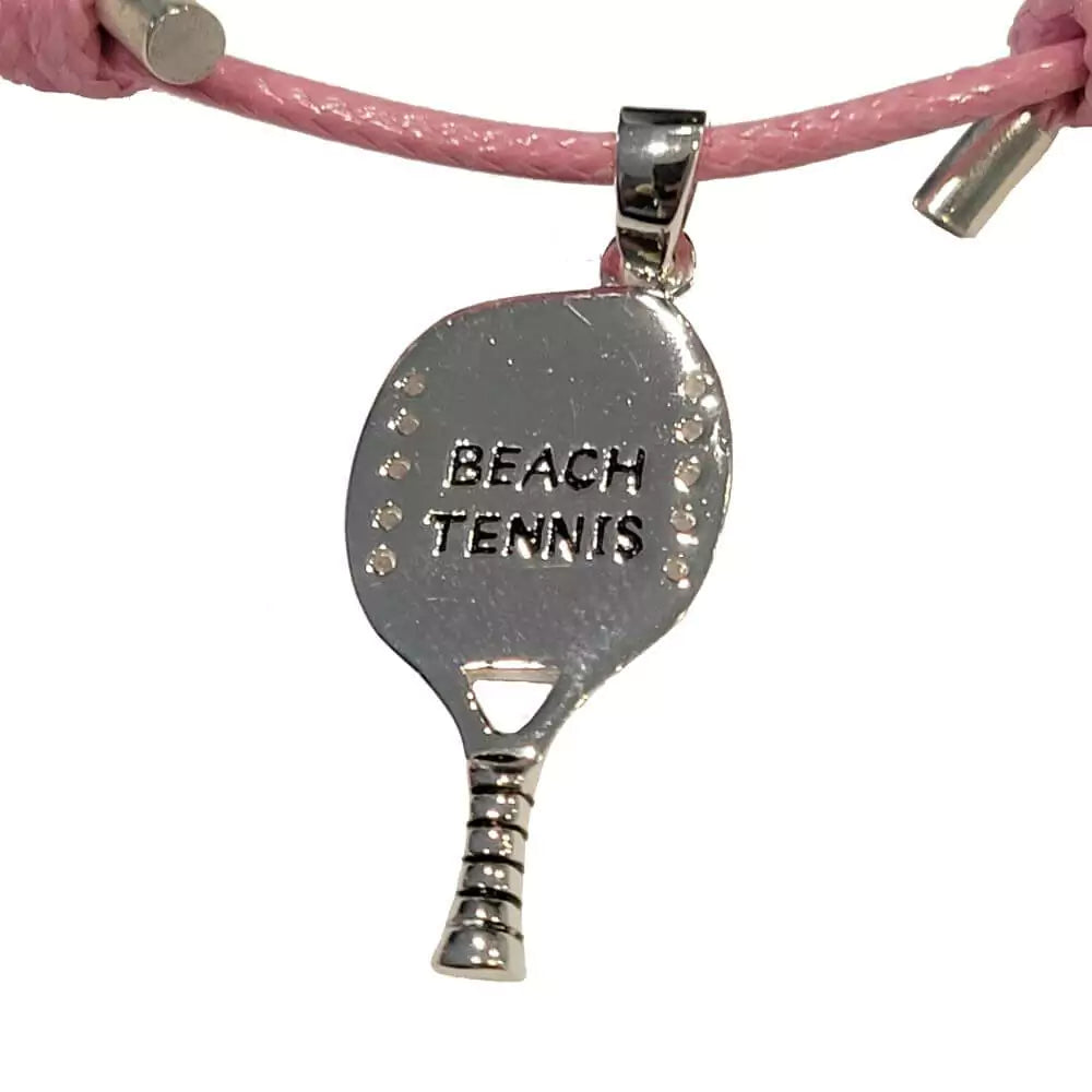Shop Necklaces - Kreoli Bijoux pink Necklace with Beach Tennis Racket. Simple pink braided cord featuring a Beach Tennis Raquet. Close up view of racket.