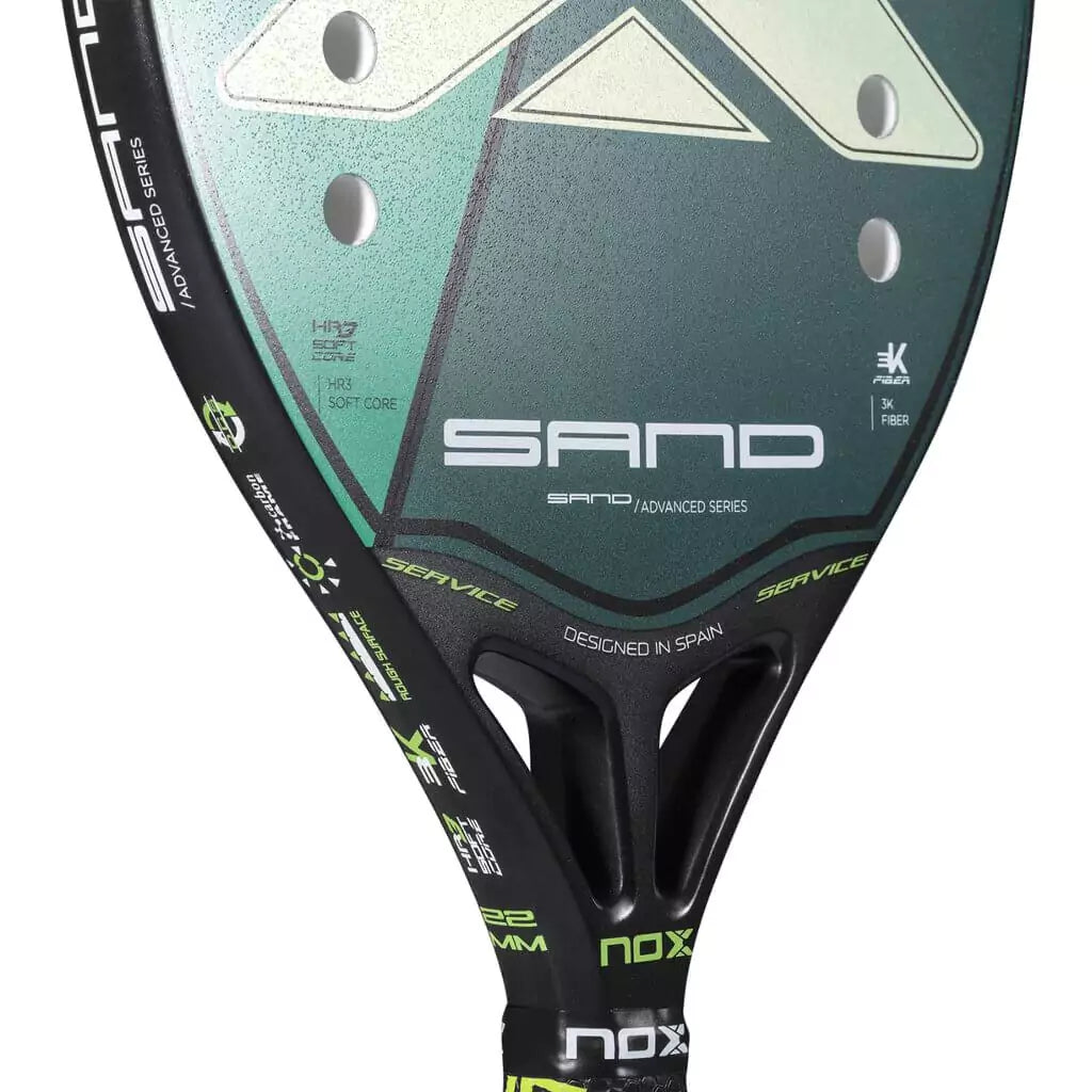 iambeachtennis BT Shop - Nox Beach Brand year 2022 BT paddle. The Racket model is a Nox Beach SAND GREEN Beginner/Intermediate Beach Tennis racket - close up of the Racchetta / raquete face and neck.