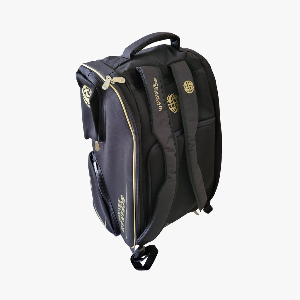 im beach tennis depot store presents Ocean Air Beach Tennis PRO BT Racket Bag in black and gold.  Images shows backpack straps.