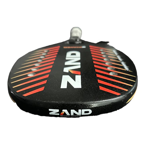 "i am Beach Tennis" Depot/Warehouse store - Zand Beach Tennis Brand year 2023 BT paddle. The Racket model is a Zand POWER 12K Advanced and Professional/Pro Beach Tennis racket - Flat Face view of the racket/ raquete help by player.